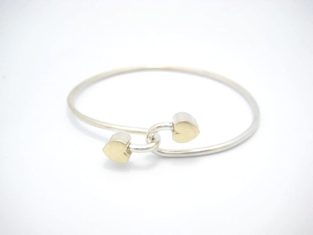 TIFFANY & CO. 18K GOLD AND STERLING SILVER HEART BANGLE BRACELET