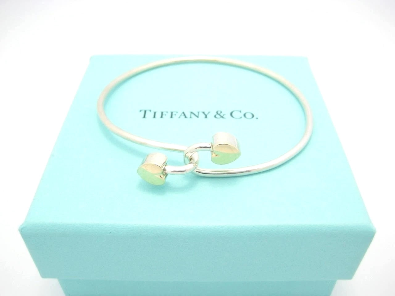 TIFFANY & CO. 18K GOLD AND STERLING SILVER HEART BANGLE BRACELET