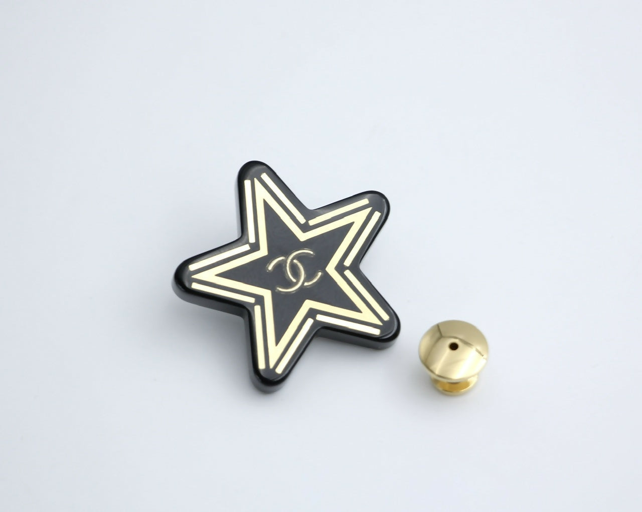 Chanel D21S Resin Black Gold Star Brooch