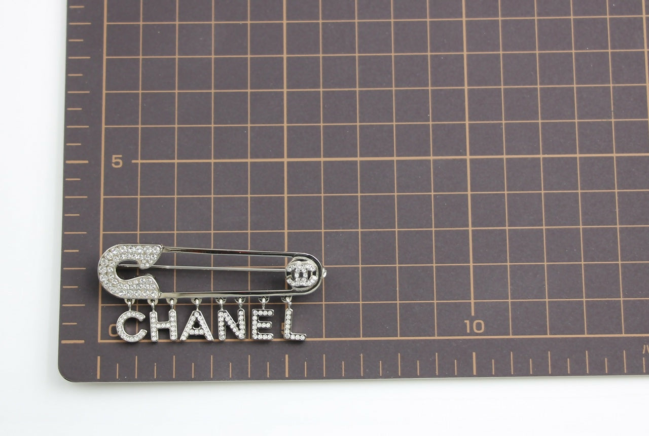 Chanel B18P Rhinestone Metal Thick ‘CHANEL’ Brooch