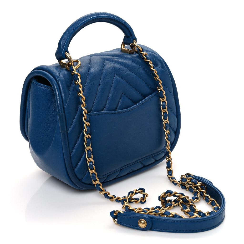 Lambskin Reverse Chevron Quilted Mini Round Top Handle Flap Blue