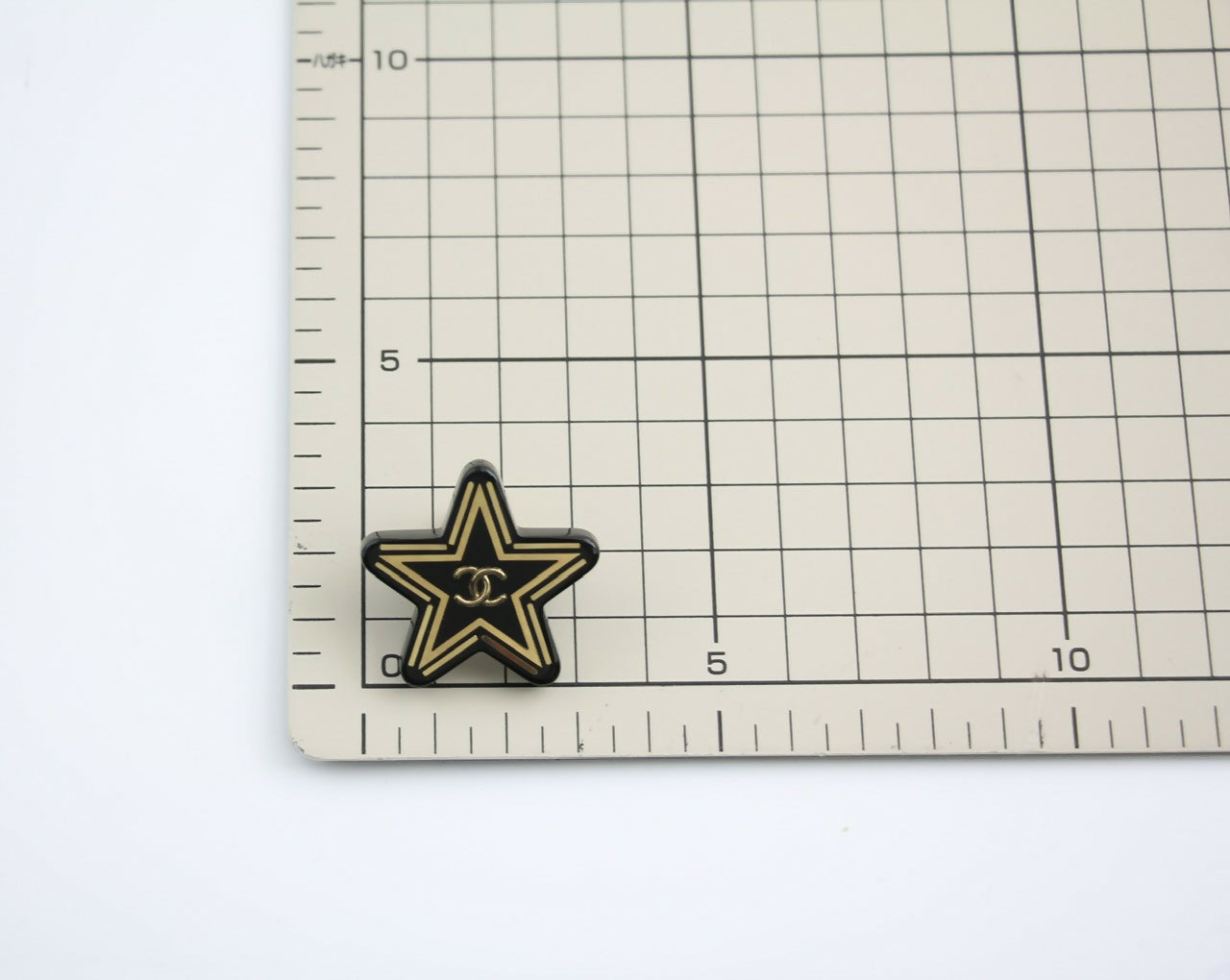 Chanel D21S Resin Black Gold Star Brooch