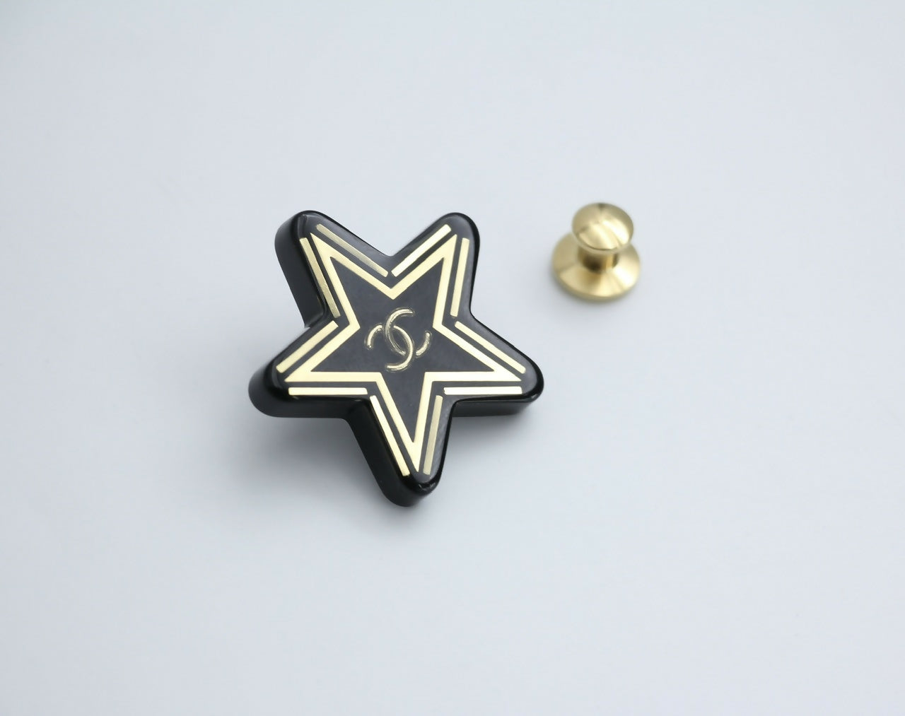 Chanel D21S Resin Black Gold Star Brooch