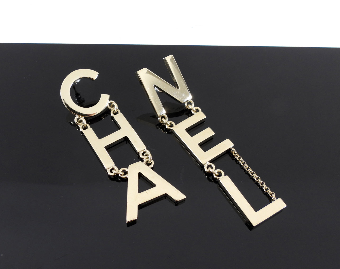 Chanel 19S Light Goldtone Spellout Logo Drop Earrings