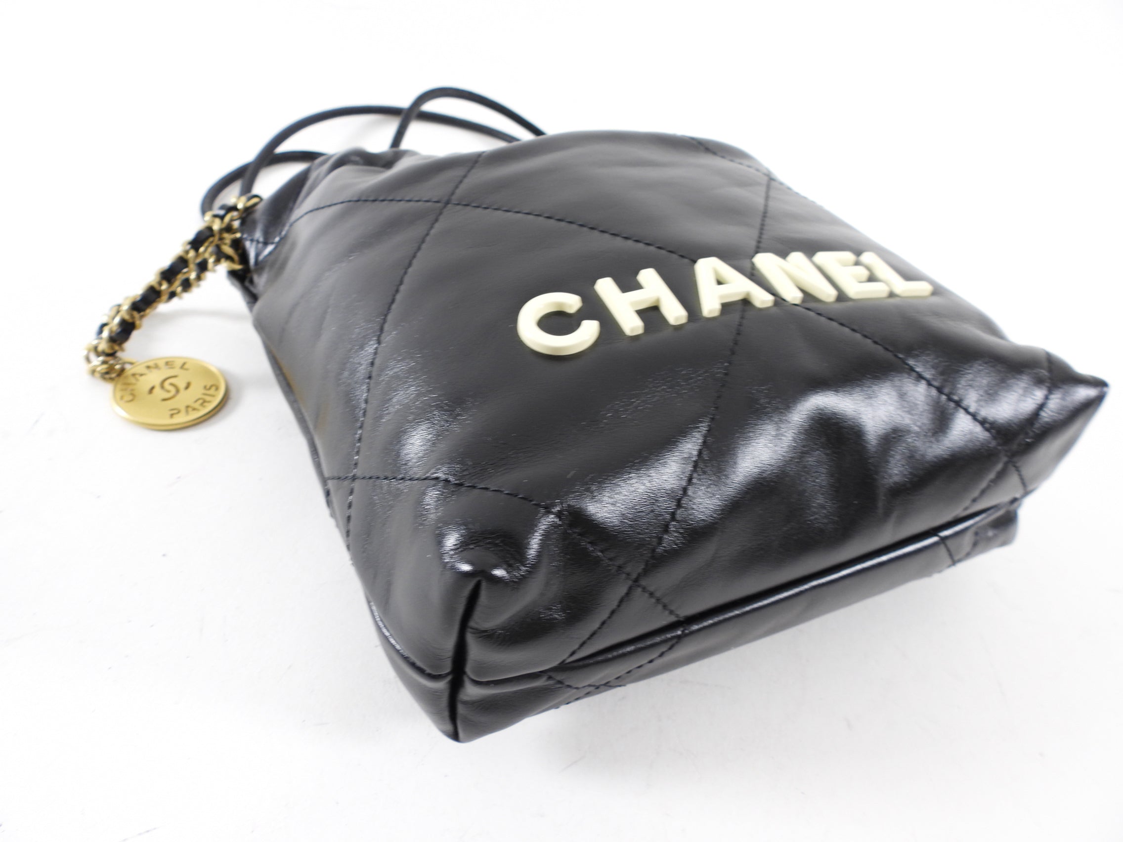 Chanel 2023 Black Leather Chain 22 Mini Bag with Ivory Enamel Logo