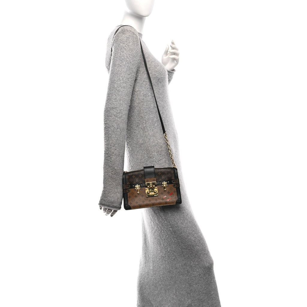 Reverse Monogram Trunk Clutch