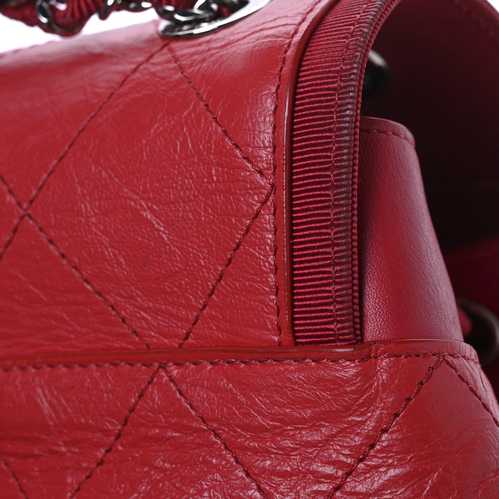 Crumpled Grained Calfskin Quilted Backpack Red
