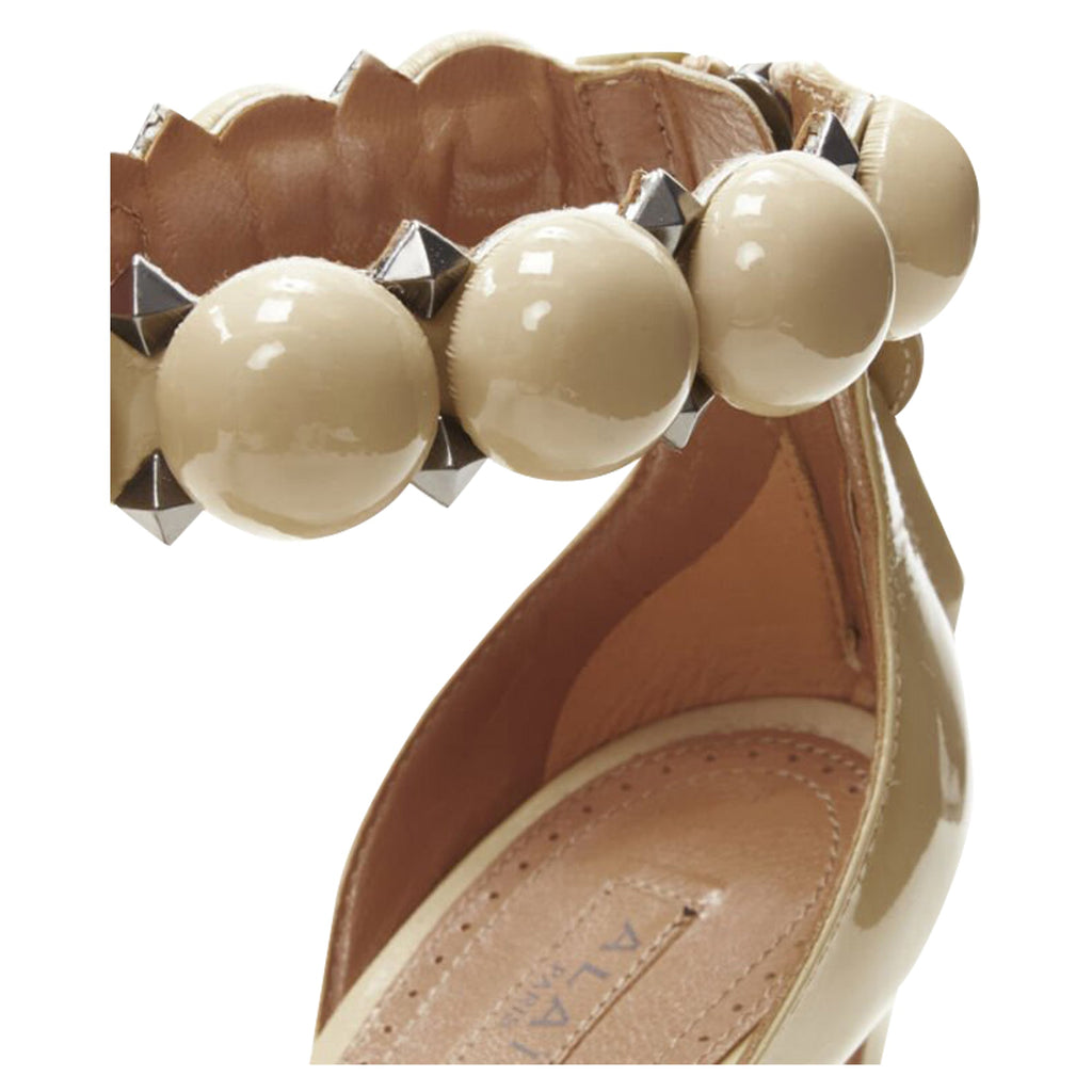 Women's Alaia La Bombe ball embellished studded nude patent high heel sandal