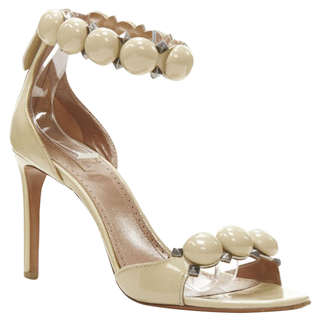 Women's Alaia La Bombe ball embellished studded nude patent high heel sandal