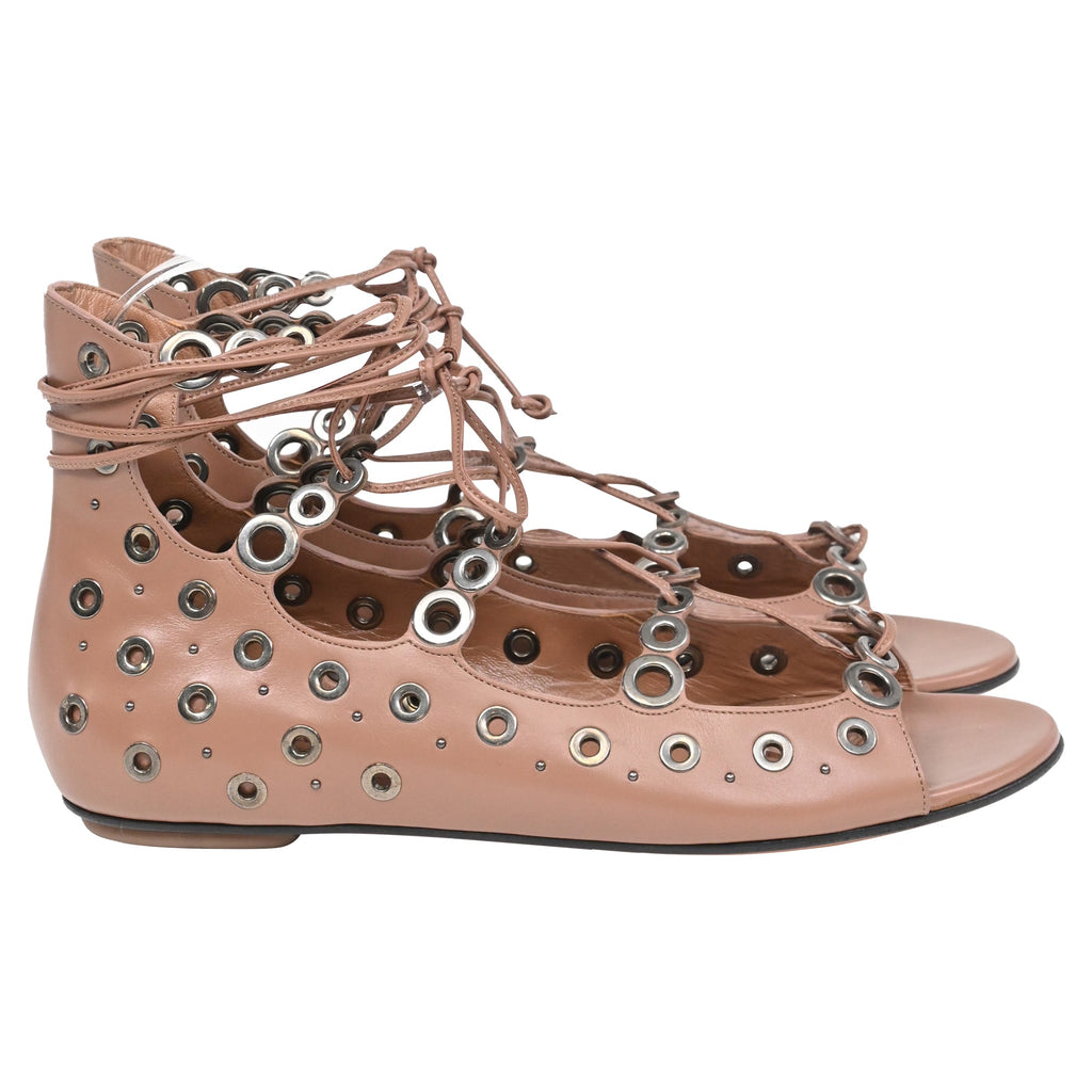 Alaïa Eyelet Strappy Flat Sandals in Brown Leather