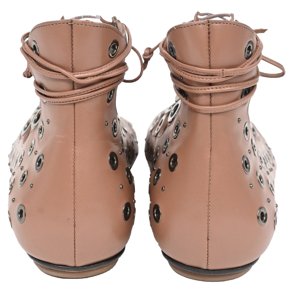 Alaïa Eyelet Strappy Flat Sandals in Brown Leather