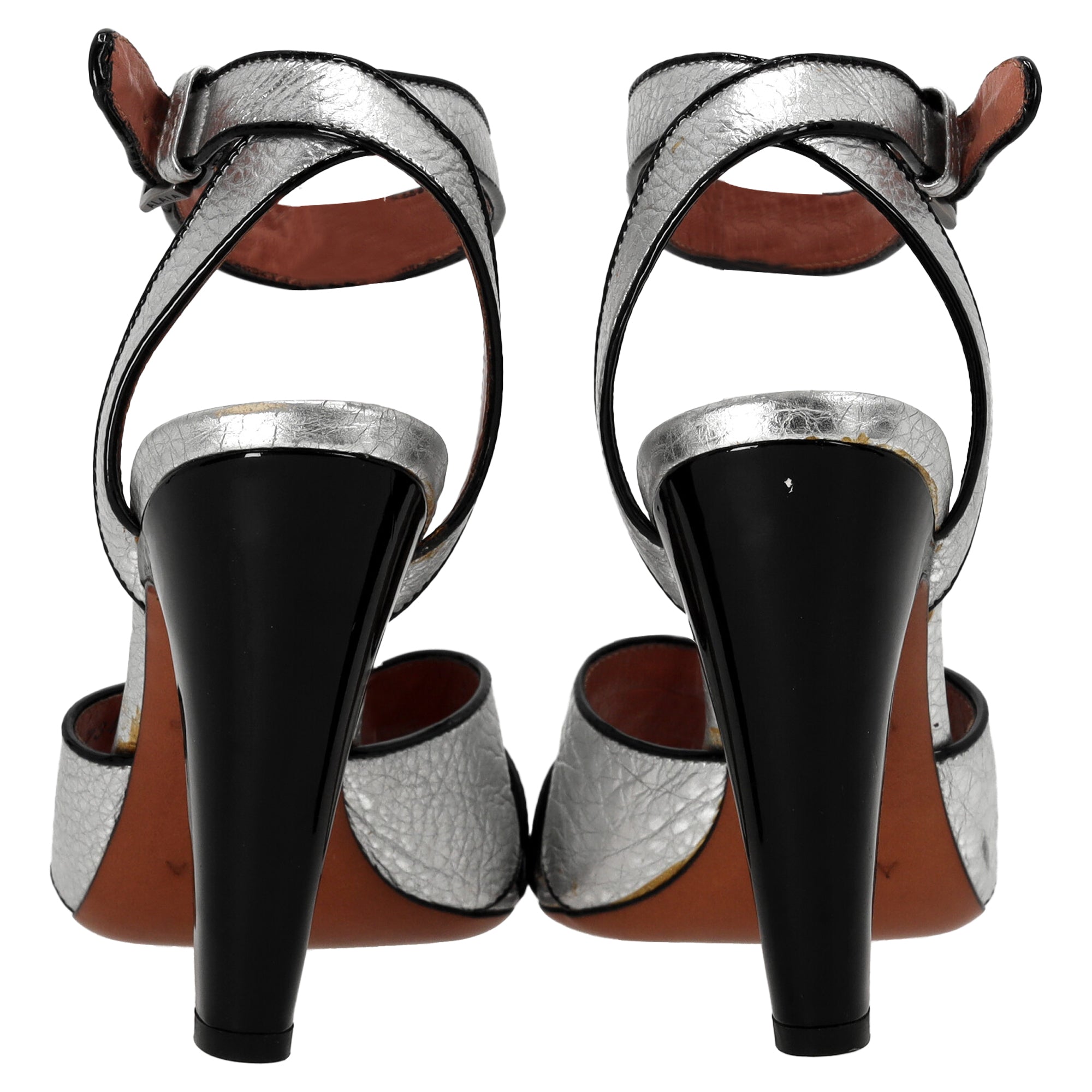 Alaia Cross Strap High Heel Sandals in Silver Leather
