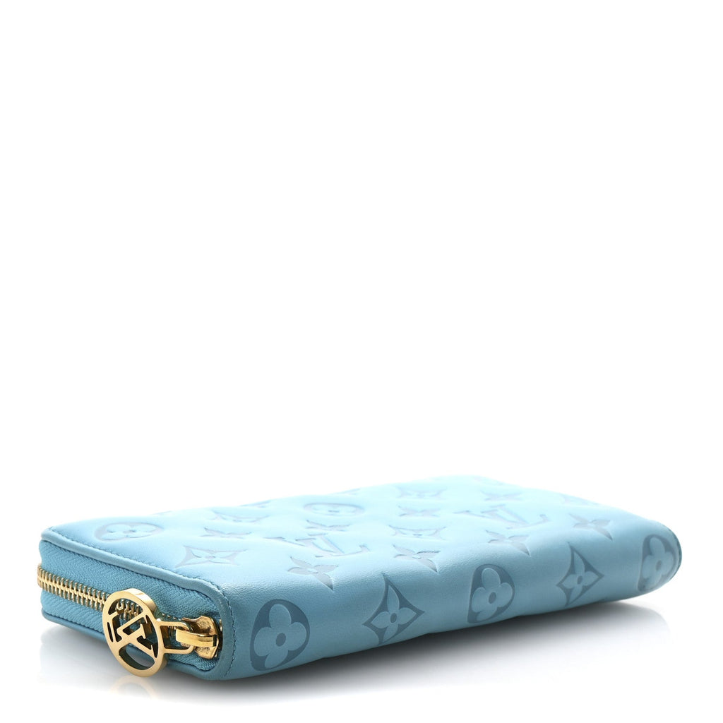 Lambskin Embossed Monogram Coussin Zippy Wallet Turquoise
