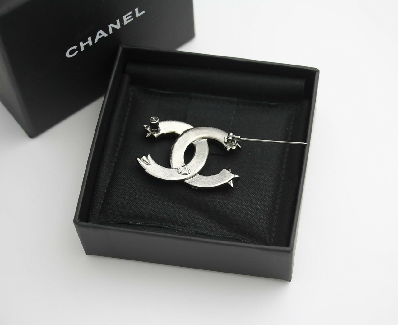 Chanel C21S Rhinestone Metal Silver Star Twist Brooch