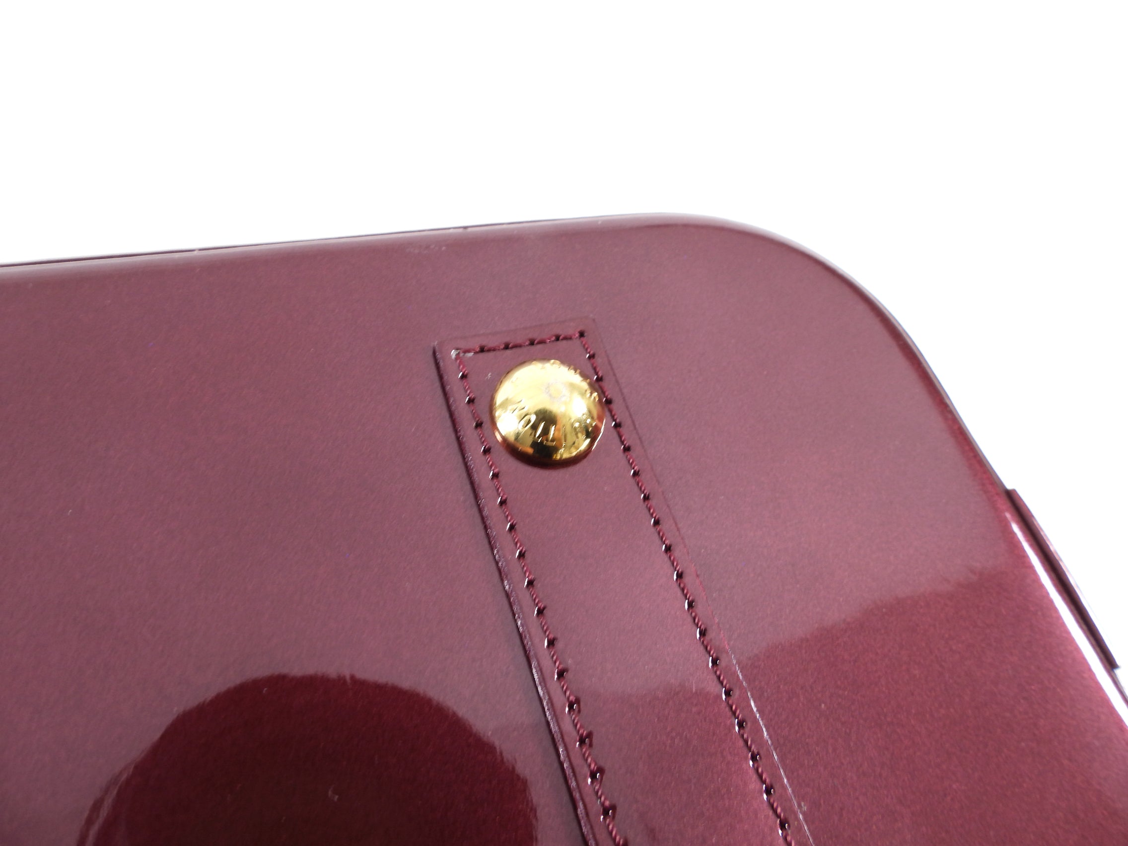 Louis Vuitton Alma PM bag in Monogram Vernis Rouge Fauviste