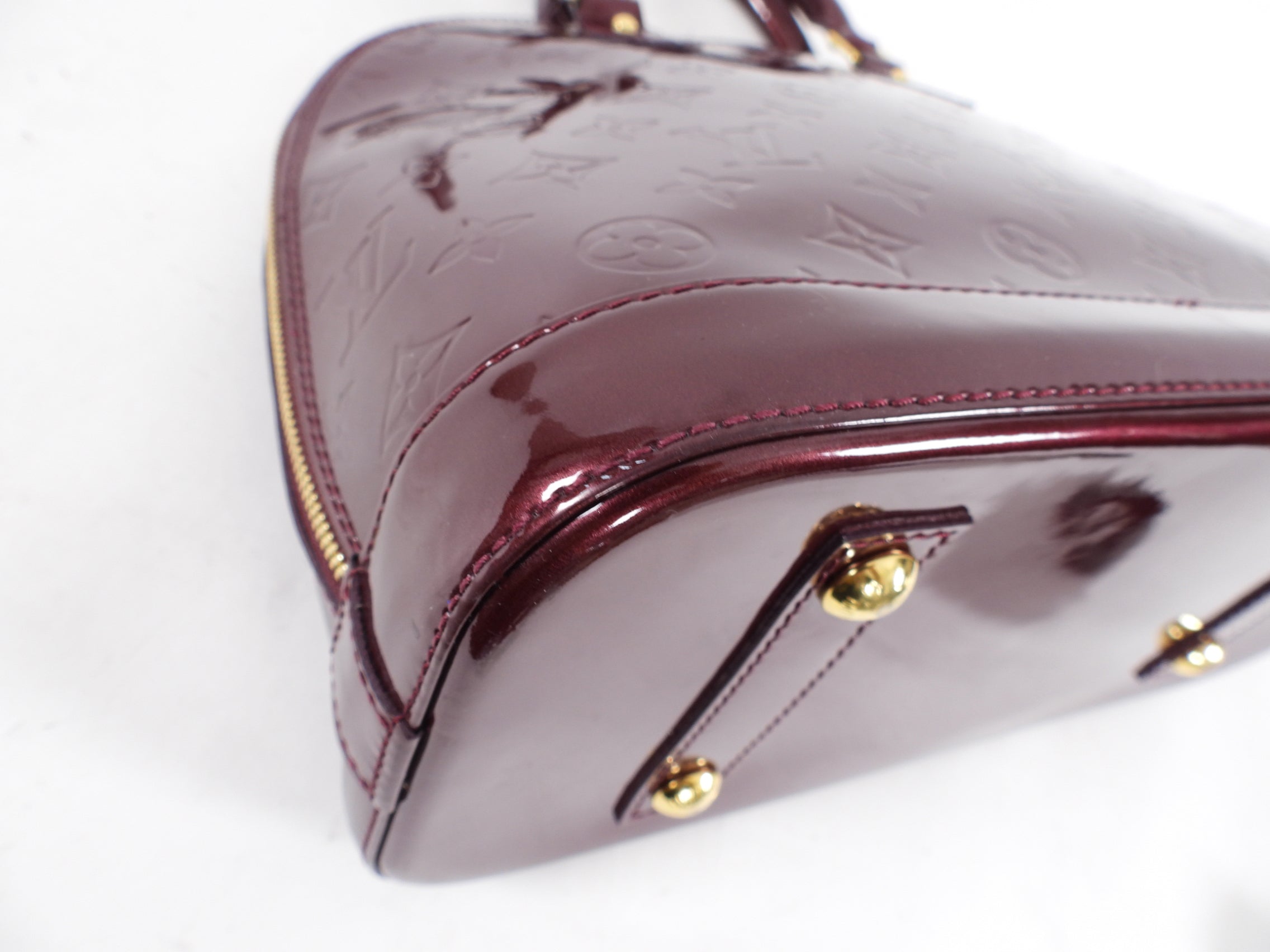 Louis Vuitton Alma PM bag in Monogram Vernis Rouge Fauviste
