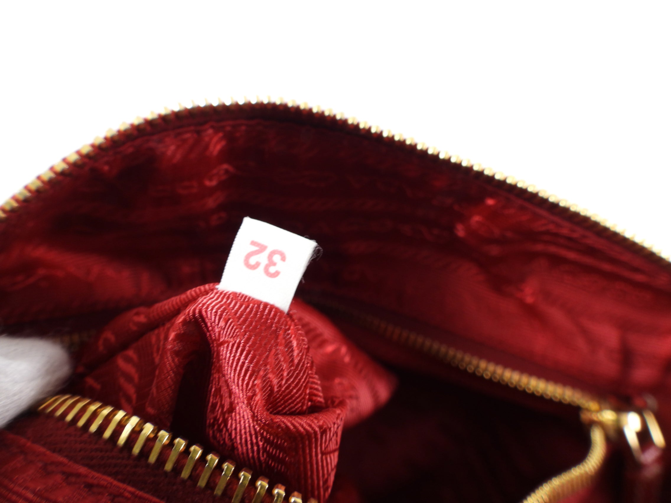 Prada Red and Black Saffiano Fori Small Barrel Bag